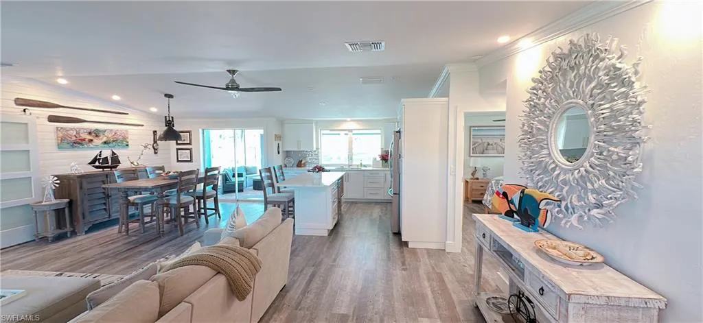 Open-concept living area featuring wood-finish flooring throughout