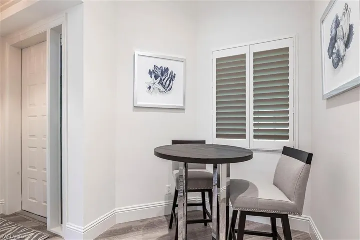 Dining room with wood finished floors and baseboards
