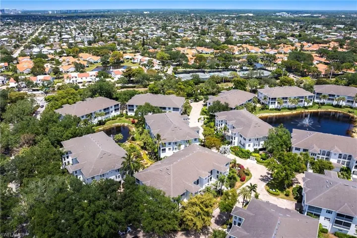 Aerial view featuring a residential view and a water view