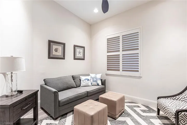 Living area with light wood-type flooring and baseboards