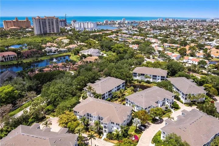 Aerial view featuring a residential view and a water view
