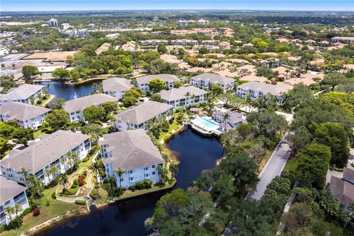 Drone / aerial view with a residential view and a water view