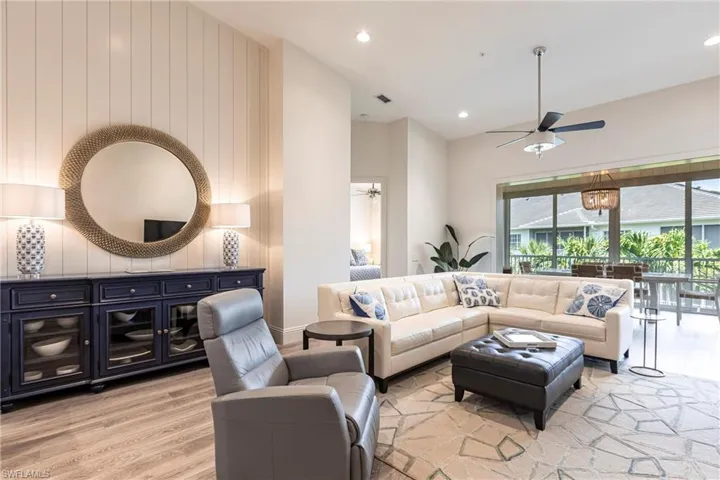 Living area with recessed lighting, a ceiling fan, visible vents, and light wood-style flooring