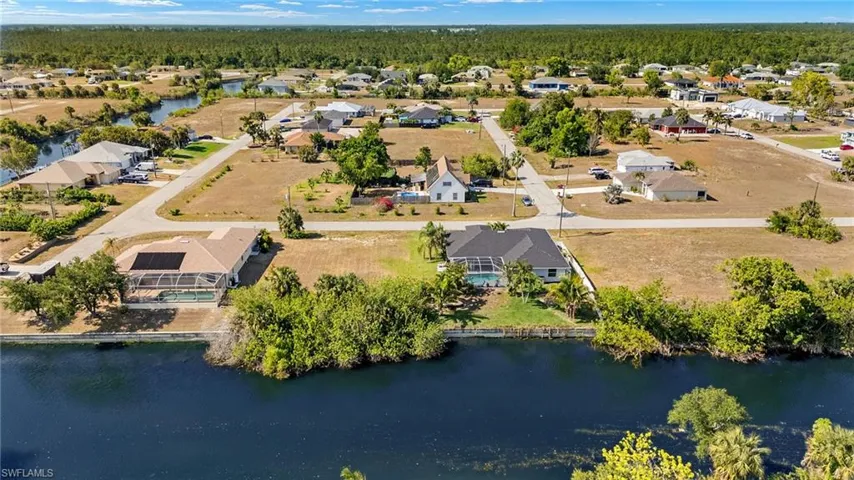 Aerial view featuring a water view and a residential view