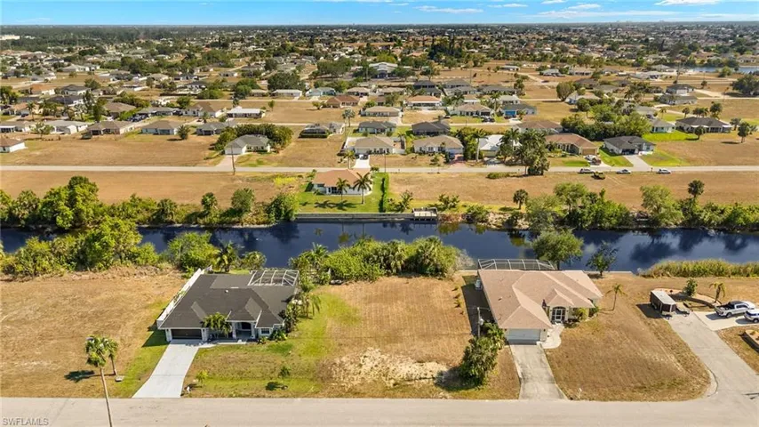 Bird's eye view with a water view and a residential view