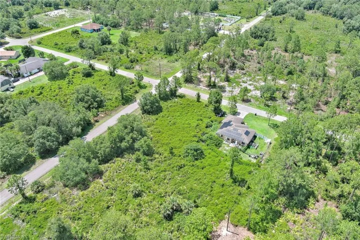 View of property location featuring a heavily wooded area