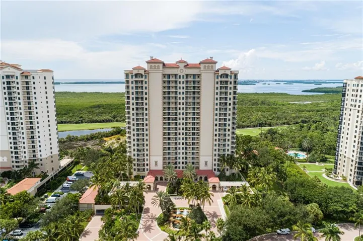 Bird's eye view of a large body of water and apartment complex