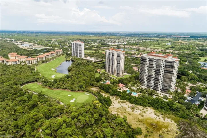 Aerial view of a local golf course and a large body of water