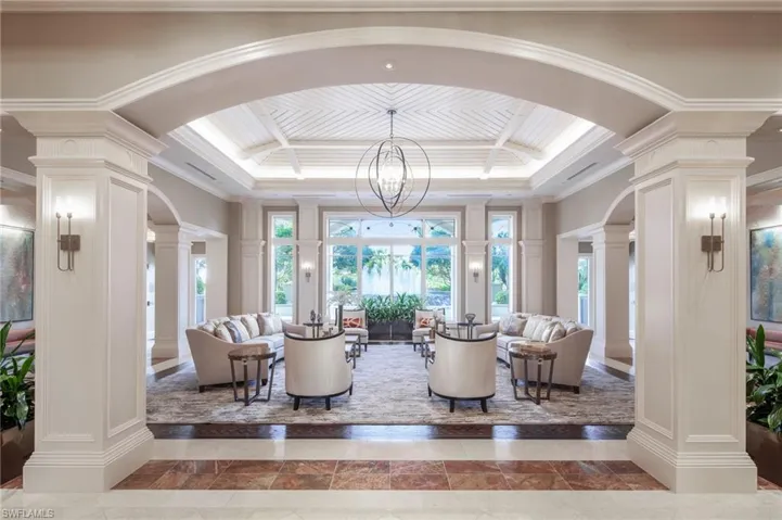 Community lobby featuring a decorative wall and ornamental molding