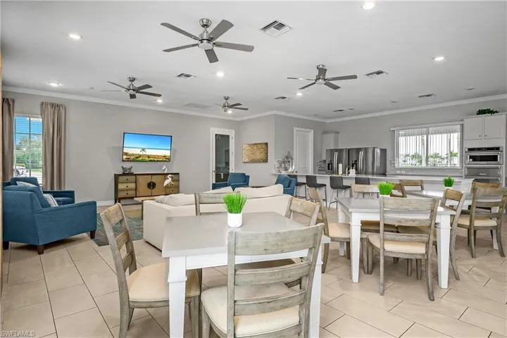Dining room featuring light tile patterned flooring, ornamental molding, and recessed lighting