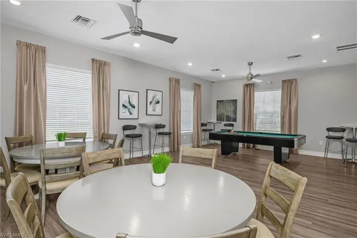 Dining room featuring billiards, wood finished floors, recessed lighting, and ceiling fan