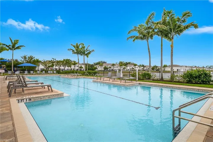 Community pool with a patio
