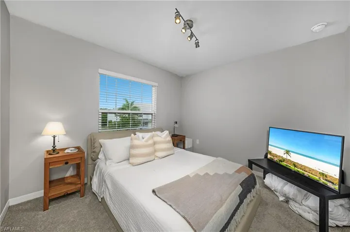 Bedroom with carpet and baseboards