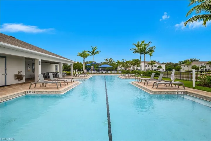 Community pool with a patio area