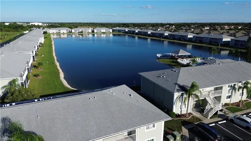 Aerial view over building towards lake
