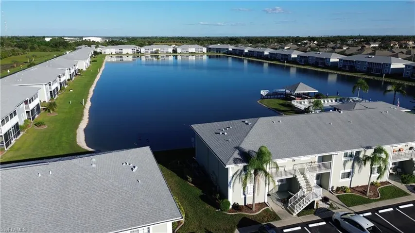 Aerial view over building towards lake