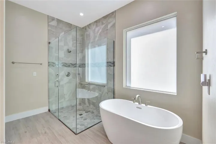 Primary Bathroom with separate tub & shower.