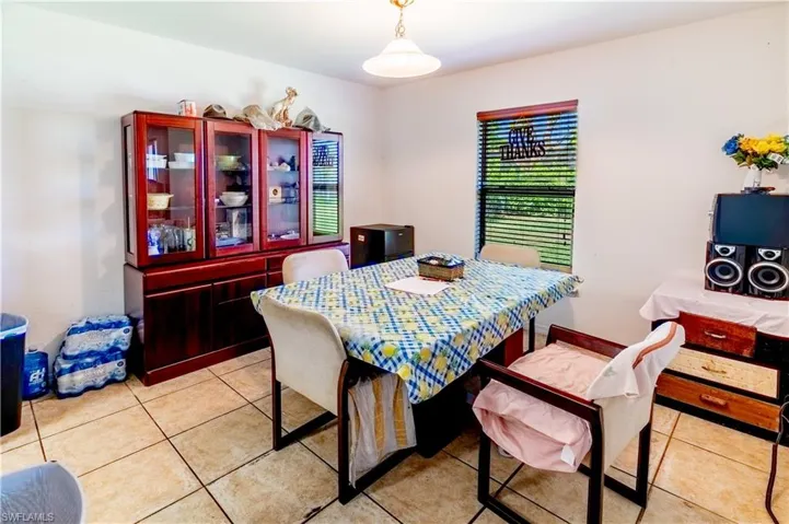 Dining room with light tile patterned floors