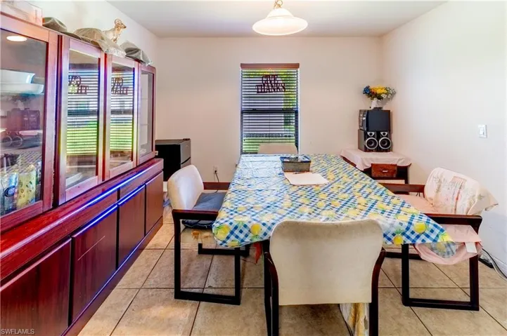 Dining area featuring light tile patterned floors