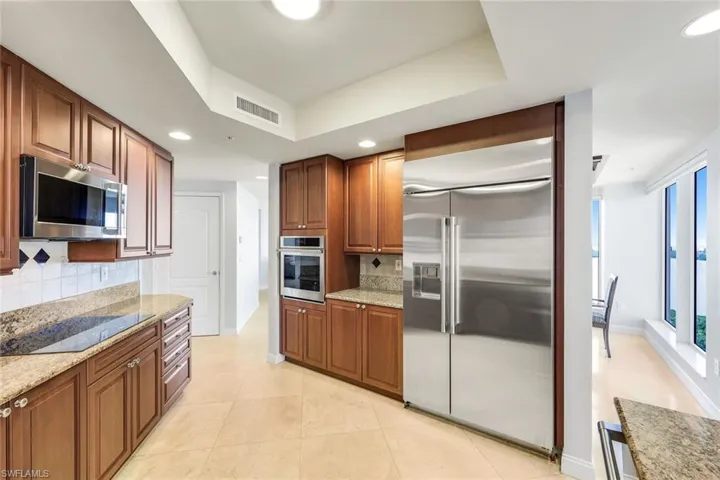 Kitchen with ample cabinetry, stainless appliances and plenty of prep space.
