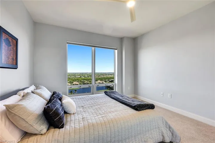 This guest bedroom, situated on the opposite side of the home, provides privacy for visitors.