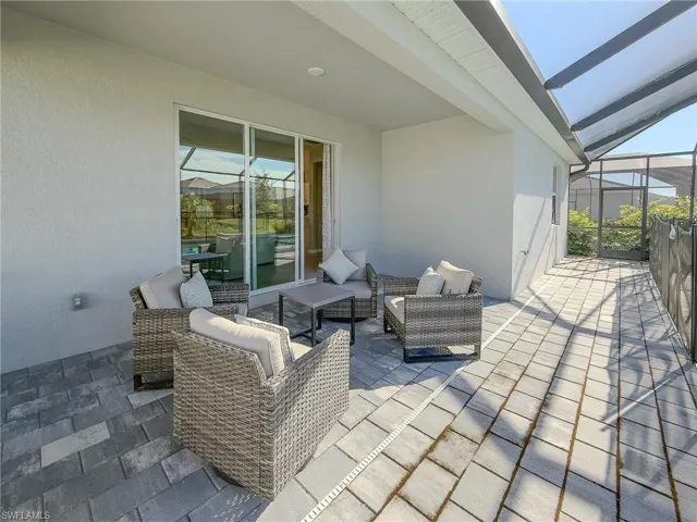 View of patio / terrace with a sunroom, glass enclosure, and outdoor lounge area