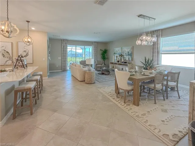 Dining space with a chandelier and recessed lighting