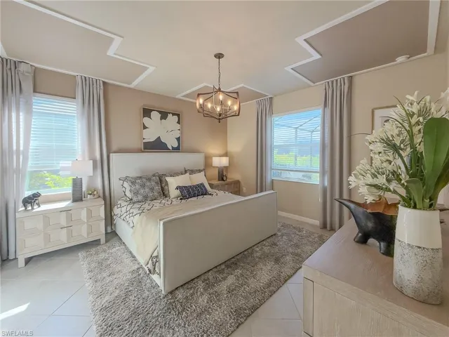 Bedroom with tile patterned flooring and a chandelier