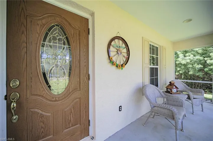 View of the Front Entrance to property featuring a covered porch.