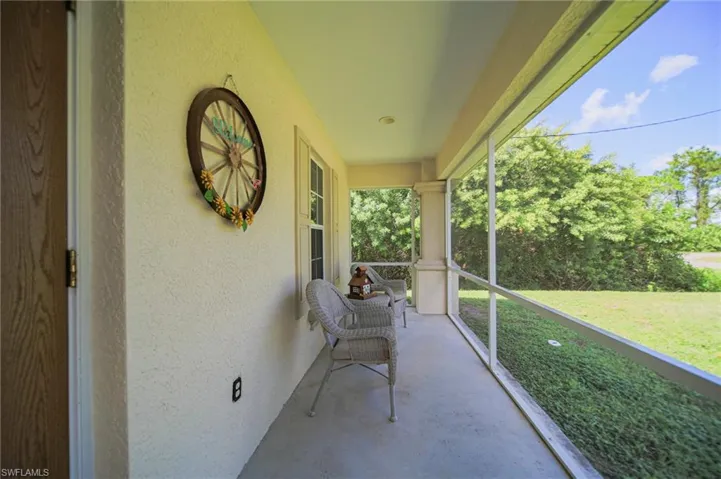 View of the front patio / terrace featuring a balcony