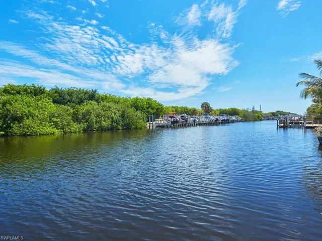 Property view of water featuring a boat dock