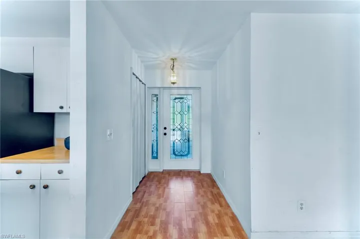 Entrance foyer featuring light wood finished floors and baseboards