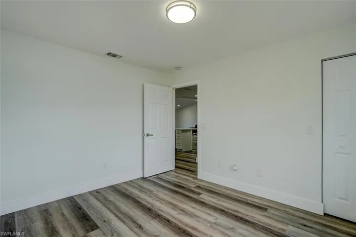 Unfurnished room with light wood-type flooring