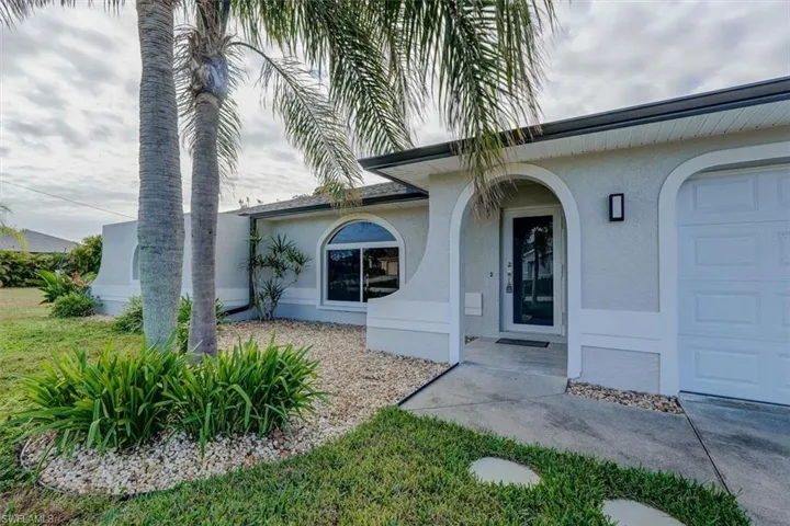 Property entrance featuring a garage
