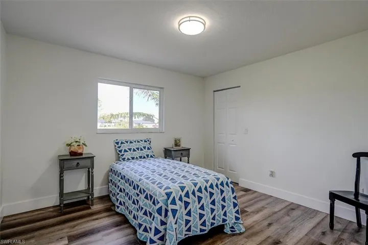 Bedroom featuring a closet and hardwood / wood-style flooring