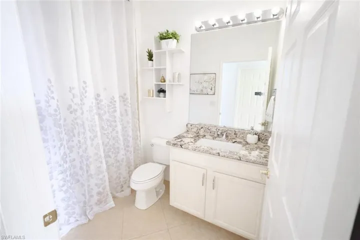 Guest bathroom with large shower curtain