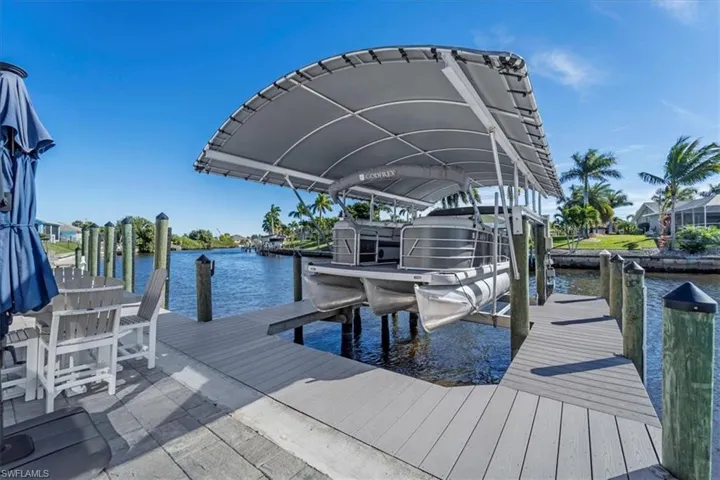 Dock featuring a water view and boat lift