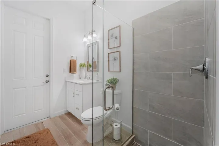 Bathroom featuring vanity and wood tiled floors