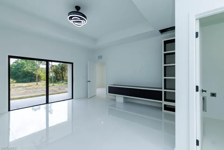 Spare room with a raised ceiling
