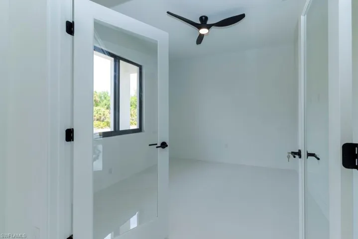 Spare room featuring a ceiling fan