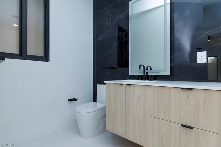 Bathroom with toilet and vanity