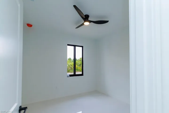 Unfurnished room featuring ceiling fan