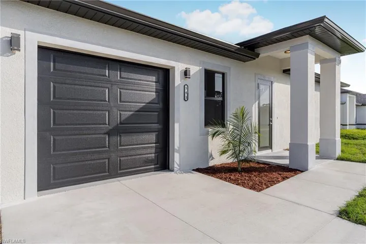 Entrance to property with a garage