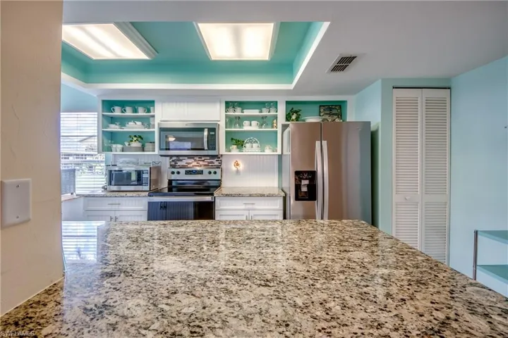 ALL NEW WOOD CABINETRY BY CORNERSTONE.  GRANITE COUNTER-TOPS.  UPPER DOORS AVAILABLE FROM CORNERSTONE IF BUYER PREFERS A DIFFERENT LOOK.
