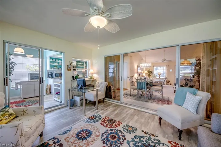 LOOKING TO GREAT ROOM DINING AREA.  KITCHEN ON LEFT.  NEW FAN AND LIGHTING.