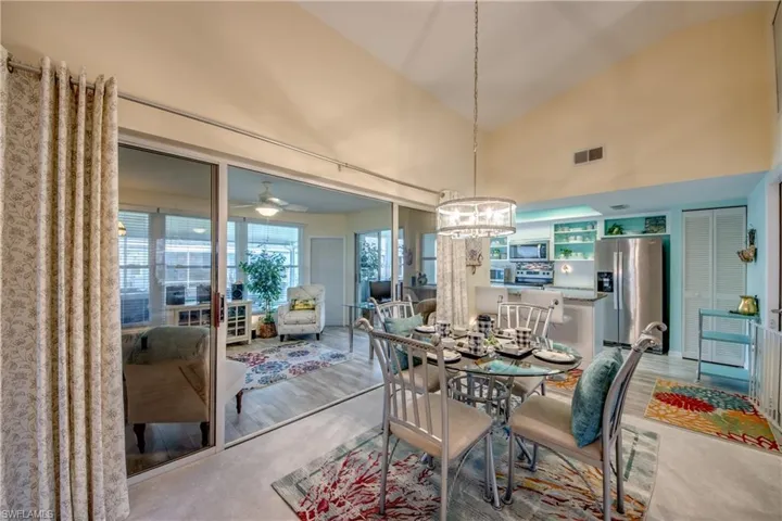 DINING AREA FOR FAMILY ROOM + KITCHEN.  ALL NEW LIGHTING INCLUDING CHANDELIER.