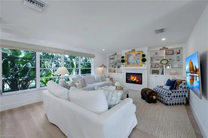 Living room with light hardwood / wood-style floors