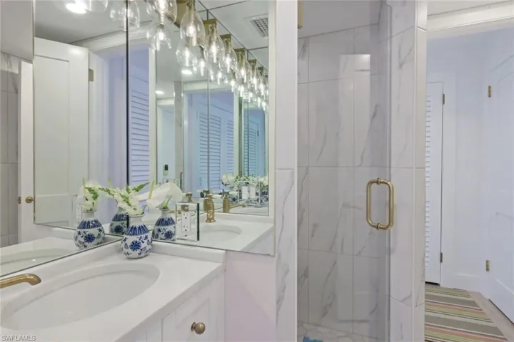 Bathroom with vanity and an enclosed shower