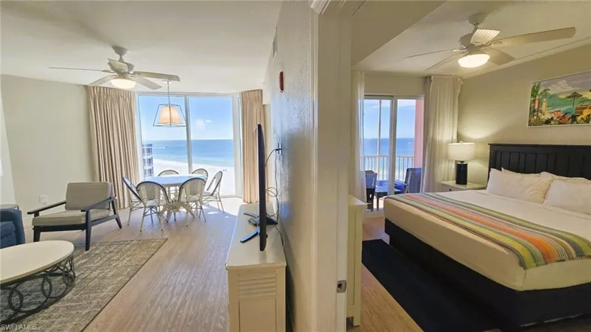 Bedroom featuring ceiling fan, light wood-type flooring