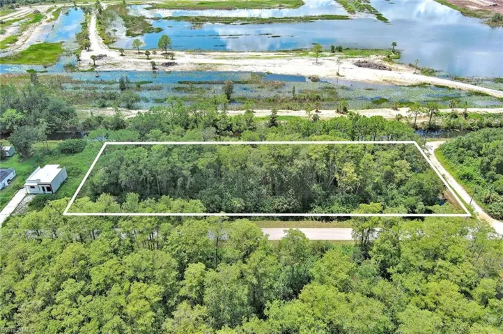Aerial overview of property's location featuring property parcel outlined
